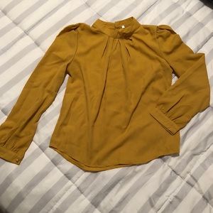 Really cute yellow top. Never worn. Too small.
